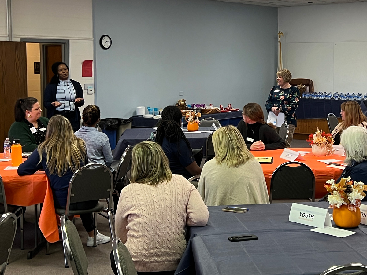 Image of people in a room for a learning workshop.